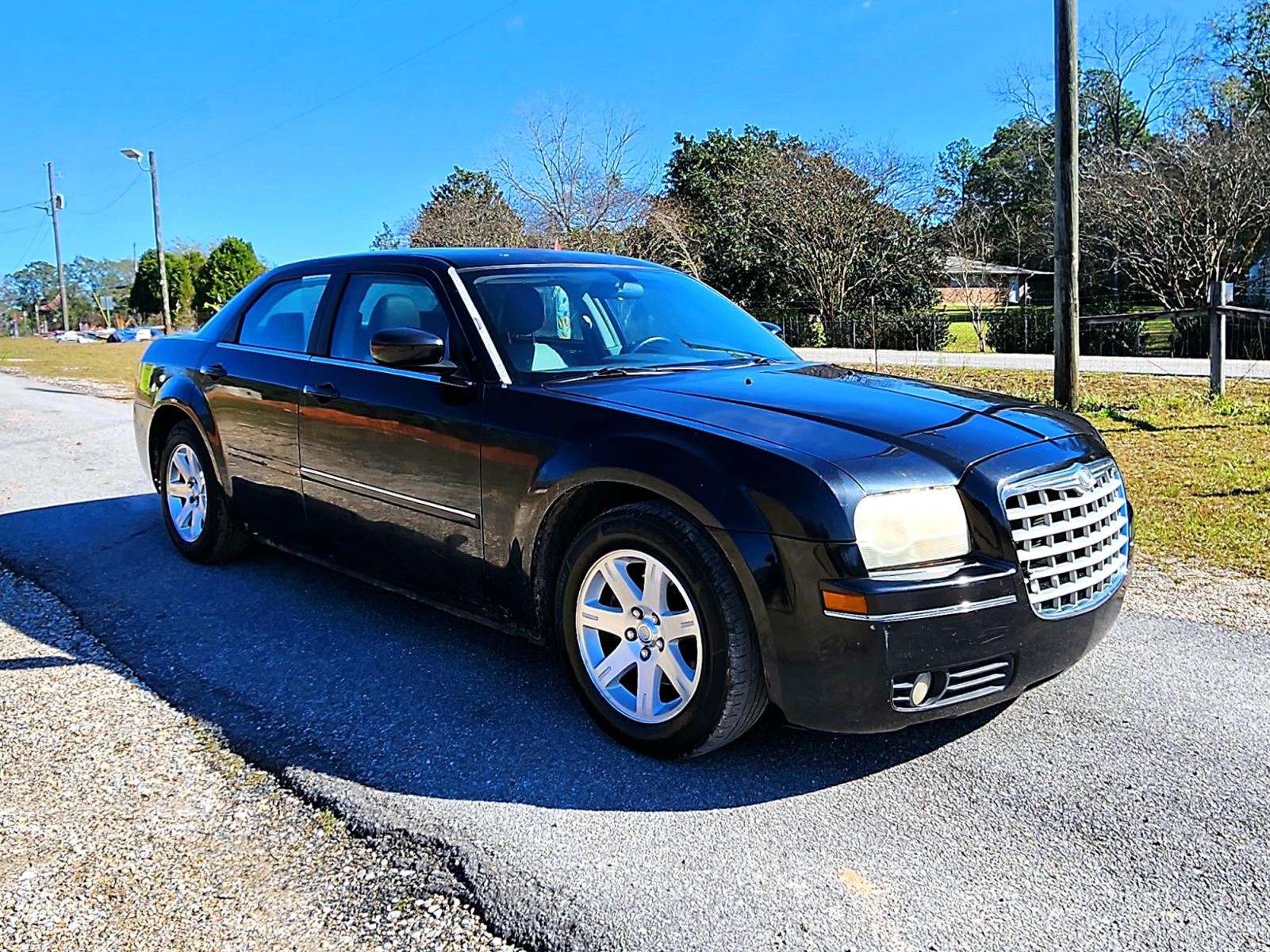 2006 Black Chrysler 300 Touring (2C3KA53G86H) with an 3.5L V6 DOHC 24V engine, 4-Speed Automatic Overdrive transmission, located at 18001 Kellogg Rd., Saucier, MS, 39574, (228) 832-1441, 0.000000, 0.000000 - SUPER SHARP !! 2006 CHRYSLER 300 TOURING – CHRYSLER Strong! - V6! 3.5L DOHC 24V – Runs GREAT - Just Serviced! – AUTOMATIC Transmission – Ice COLD A/C – Power SUNROOF – Premium -AM // FM // CD Stereo – DVD REAR ENTERTAINMENT – CRUISE with - Photo #1