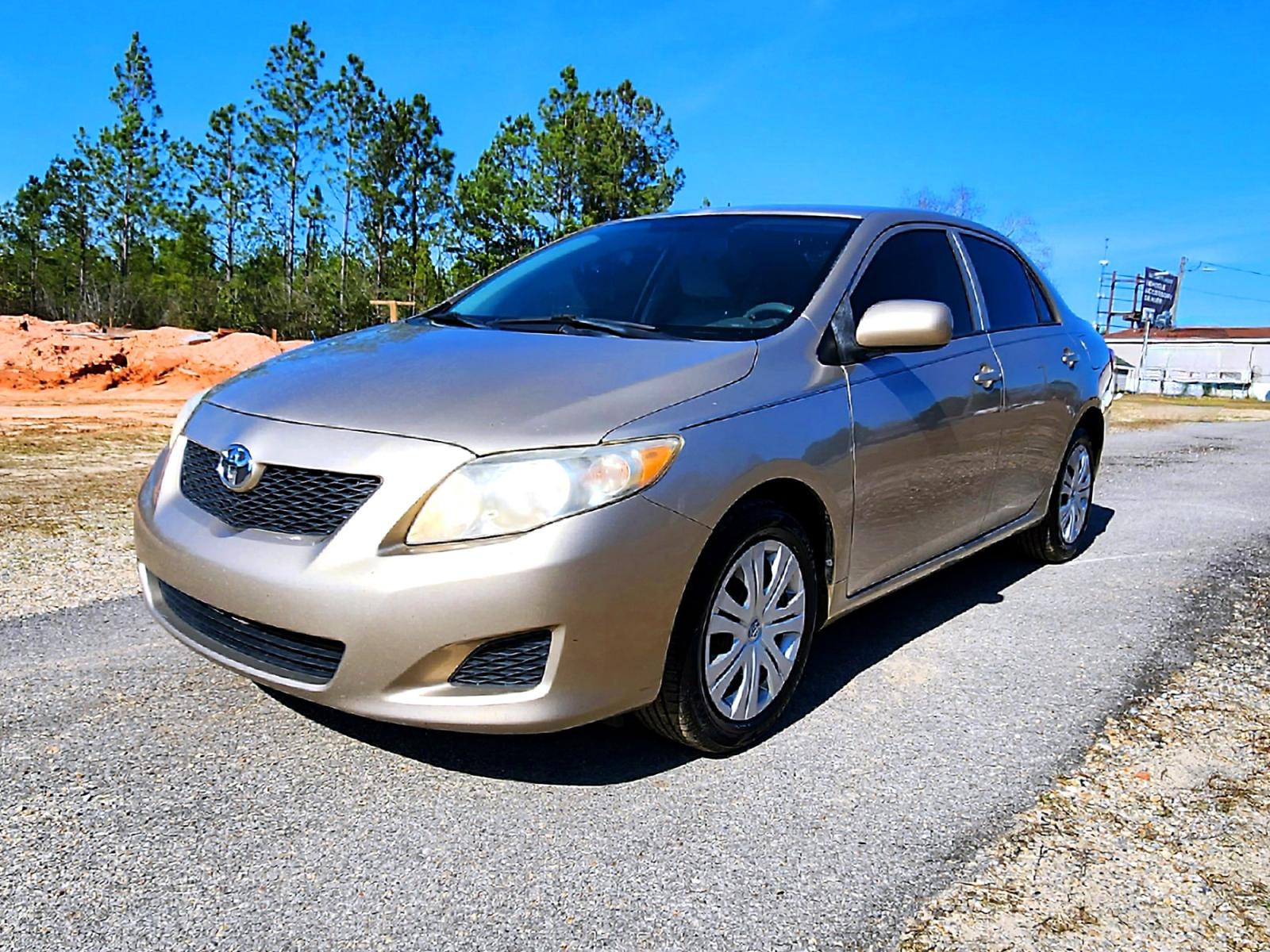 2010 Gold Toyota Corolla Base 4-Speed AT (2T1BU4EE0AC) with an 1.8L L4 DOHC 16V engine, 4-Speed Automatic transmission, located at 18001 Kellogg Rd., Saucier, MS, 39574, (228) 832-1441, 0.000000, 0.000000 - Photo #2