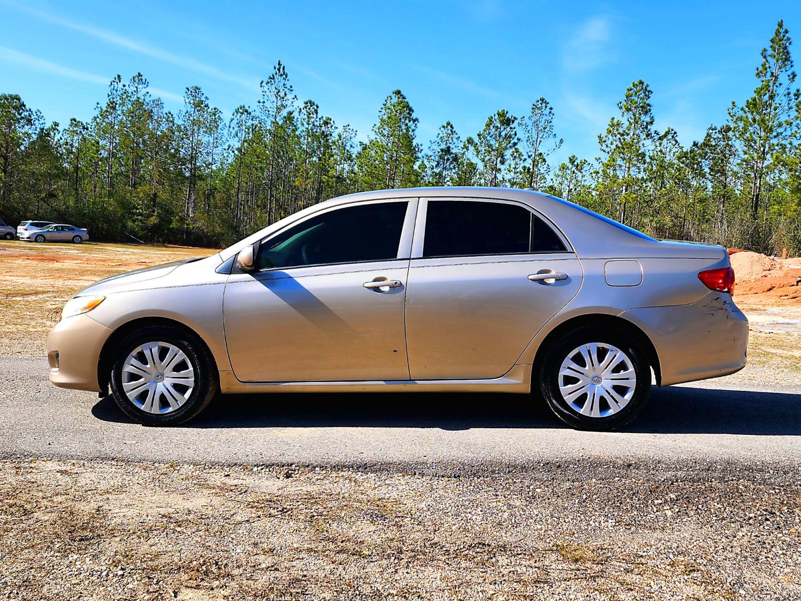2010 Gold Toyota Corolla Base 4-Speed AT (2T1BU4EE0AC) with an 1.8L L4 DOHC 16V engine, 4-Speed Automatic transmission, located at 18001 Kellogg Rd., Saucier, MS, 39574, (228) 832-1441, 0.000000, 0.000000 - Photo #3