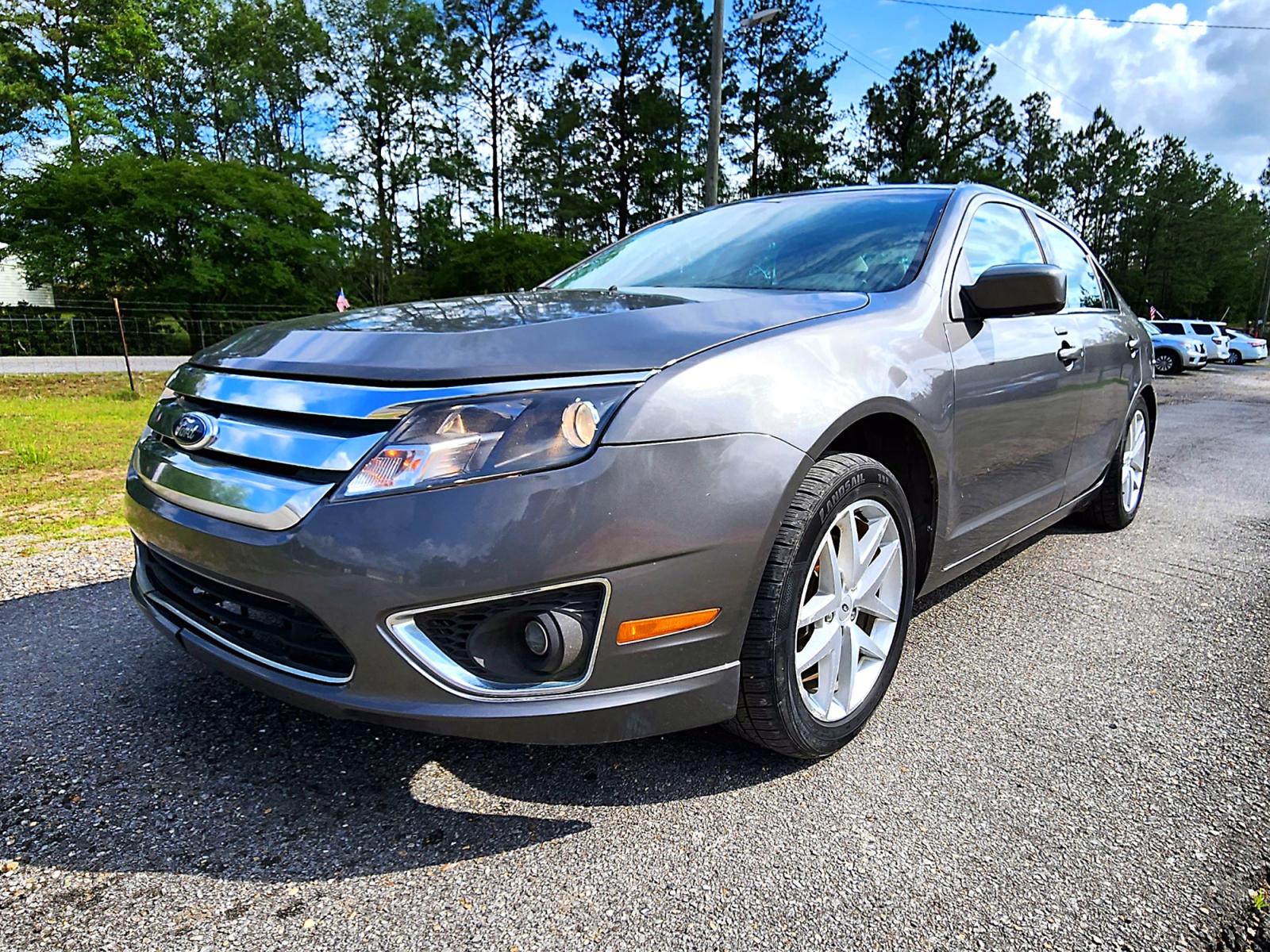 2012 Grey Ford Fusion SEL (3FAHP0JGXCR) with an 3.0L V6 DOHC 24V engine, Automatic transmission, located at 18001 Kellogg Rd., Saucier, MS, 39574, (228) 832-1441, 0.000000, 0.000000 - GREAT VALUE !! 2012 FORD FUSION SEL – FORD Strong! - V6! 3.0L DOHC 24V – Runs GREAT - Just Serviced! – CARFAX GREAT-VALUE Vehicle! – FUEL SAVER!! est. 33 MPG hwy! – AUTOMATIC Transmission – Ice COLD A/C – AM // FM // XM // CD // AUX // USB // M - Photo #1