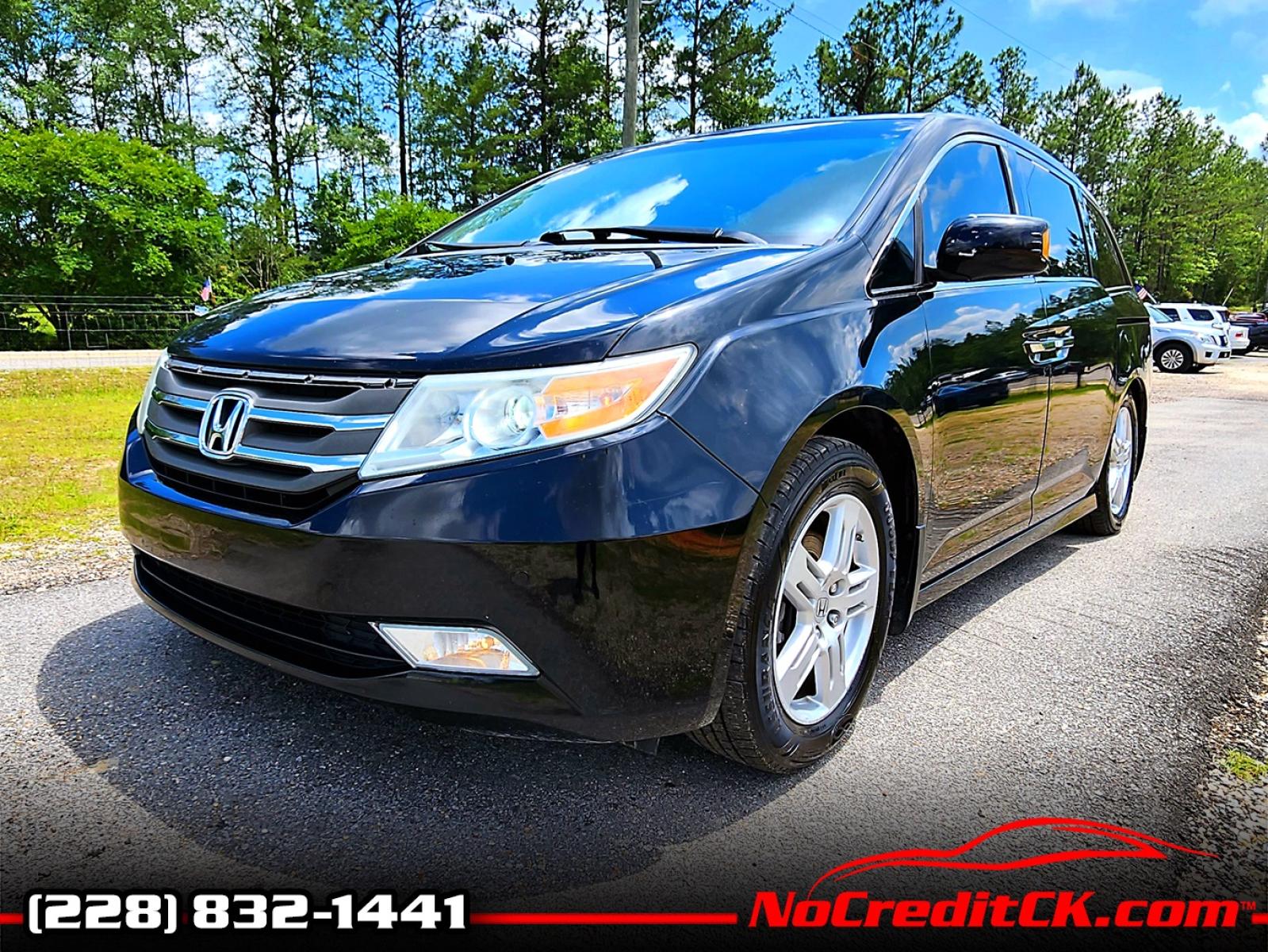 2013 Black Honda Odyssey Touring (5FNRL5H97DB) with an 3.5L V6 SOHC 24V engine, 5-Speed Automatic transmission, located at 18001 Kellogg Rd, Saucier, MS, 39574, (228) 832-1441, 139.421463, -76.641457 - Photo #0