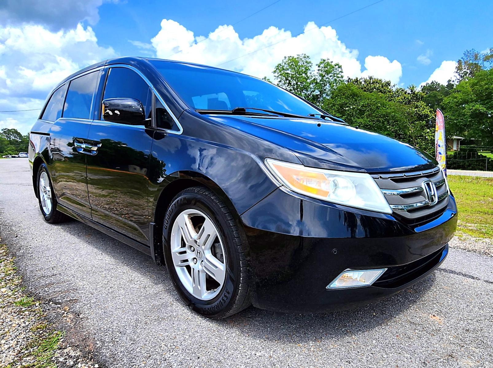 2013 Black Honda Odyssey Touring (5FNRL5H97DB) with an 3.5L V6 SOHC 24V engine, 5-Speed Automatic transmission, located at 18001 Kellogg Rd, Saucier, MS, 39574, (228) 832-1441, 139.421463, -76.641457 - Photo #1
