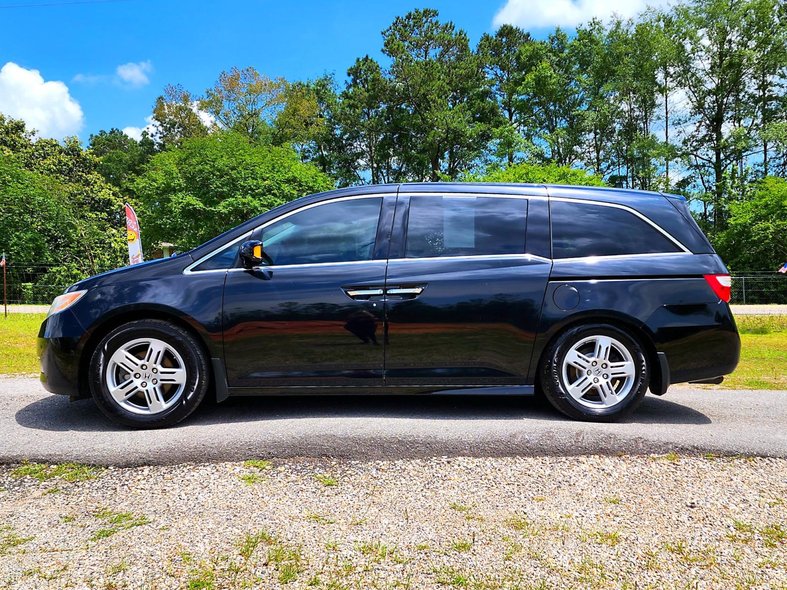 2013 Black Honda Odyssey Touring (5FNRL5H97DB) with an 3.5L V6 SOHC 24V engine, 5-Speed Automatic transmission, located at 18001 Kellogg Rd, Saucier, MS, 39574, (228) 832-1441, 139.421463, -76.641457 - Photo #2