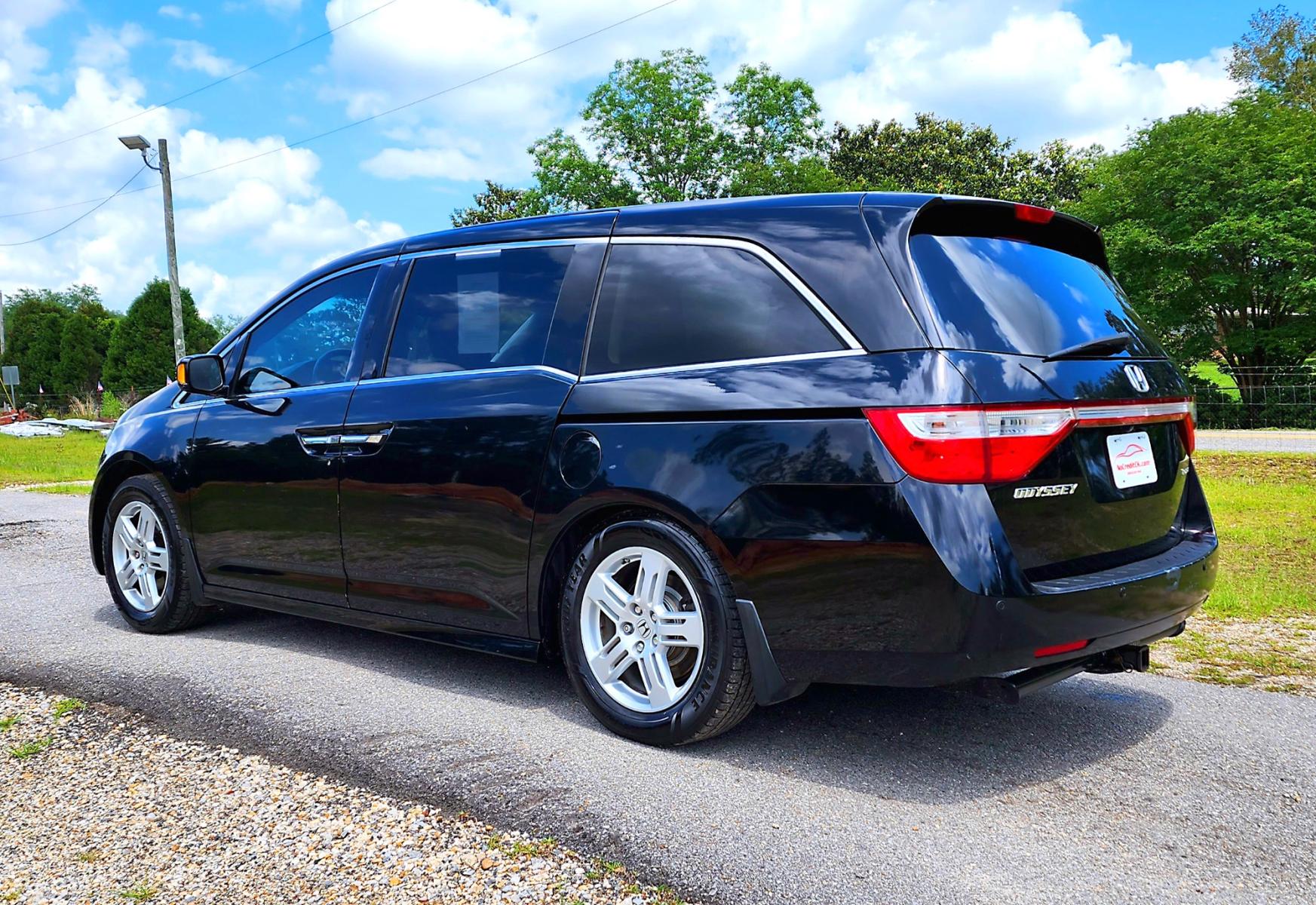 2013 Black Honda Odyssey Touring (5FNRL5H97DB) with an 3.5L V6 SOHC 24V engine, 5-Speed Automatic transmission, located at 18001 Kellogg Rd, Saucier, MS, 39574, (228) 832-1441, 139.421463, -76.641457 - Photo #5